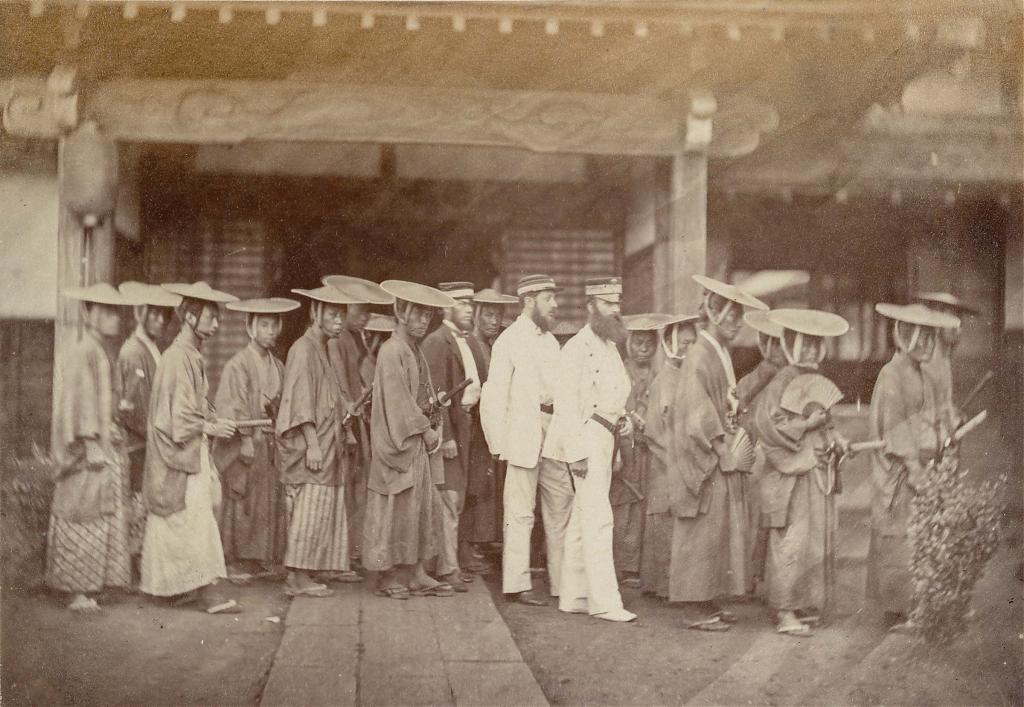 De Graeff van Polsbroek (right) and consulate staff members surrounded by their Japanese security escort